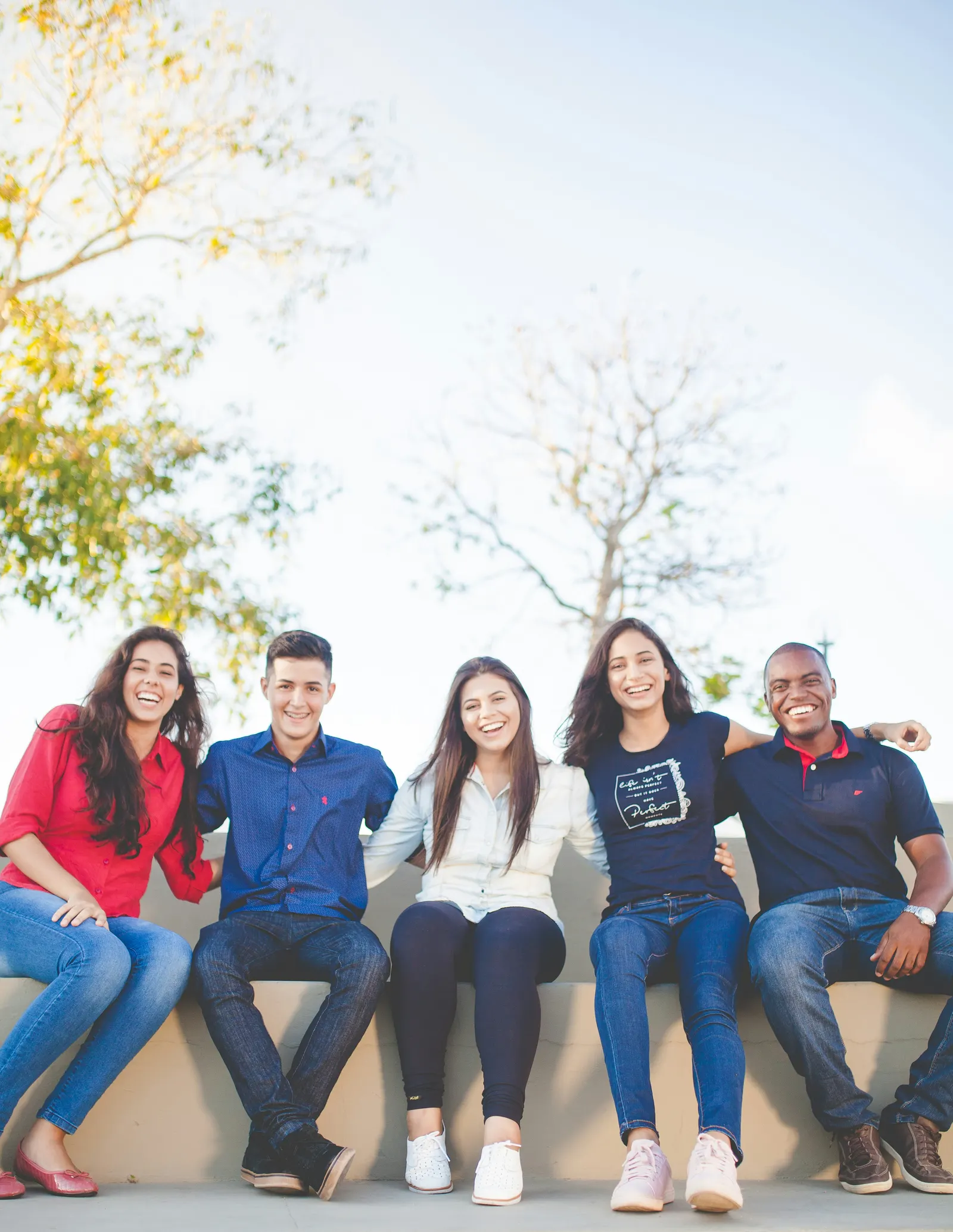 People standing together outdoors, smiling